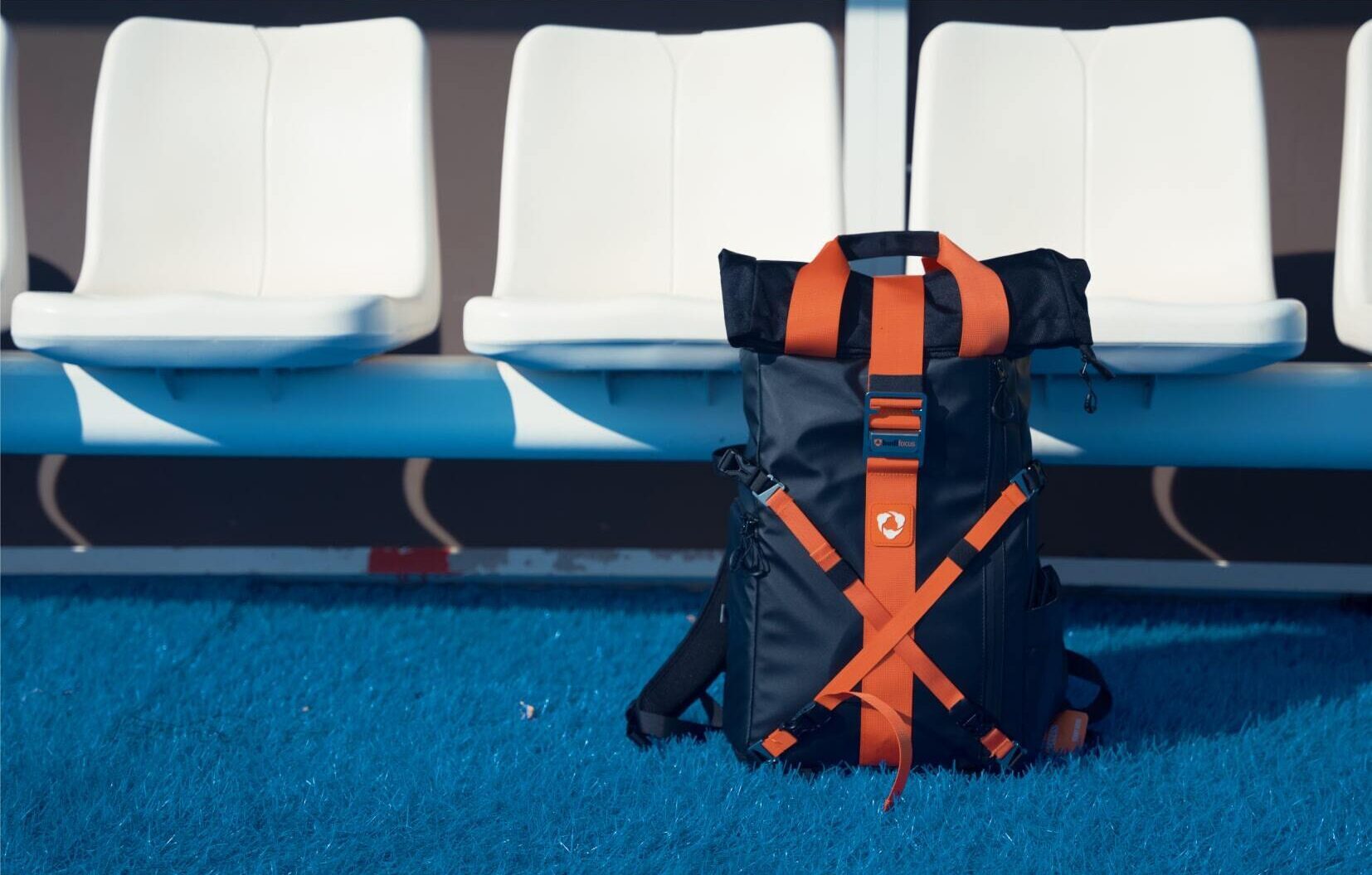 A Hudl Focus Flex backpack in front of stadium seats